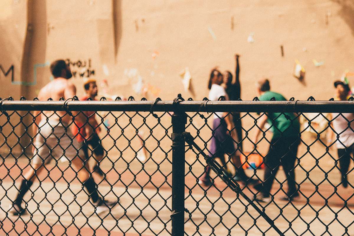 fence selective focus photography of black fence men